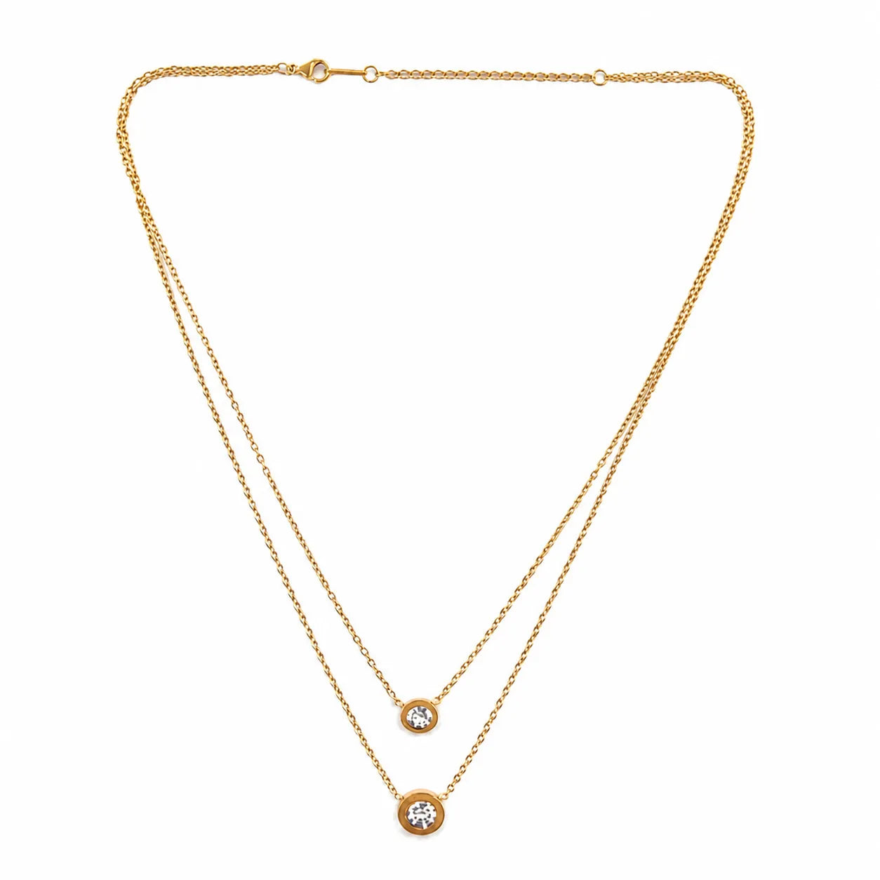 Gold necklace with two diamond pendants on a white background