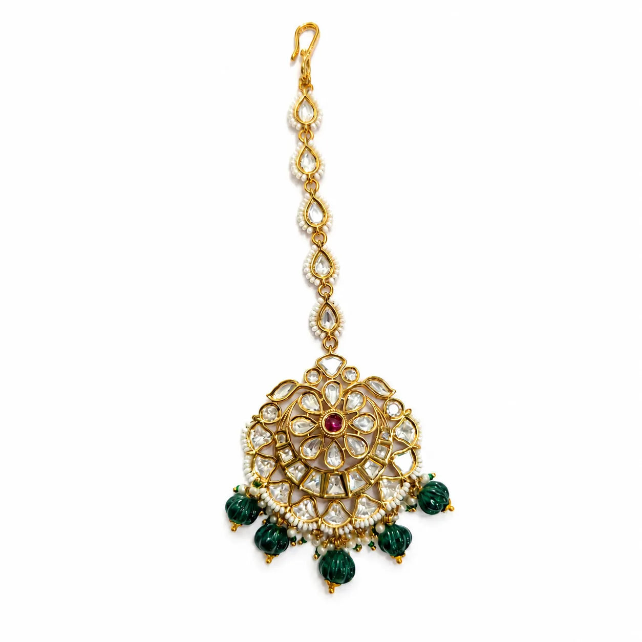 Decorative gold pendant with green gemstones on a white background