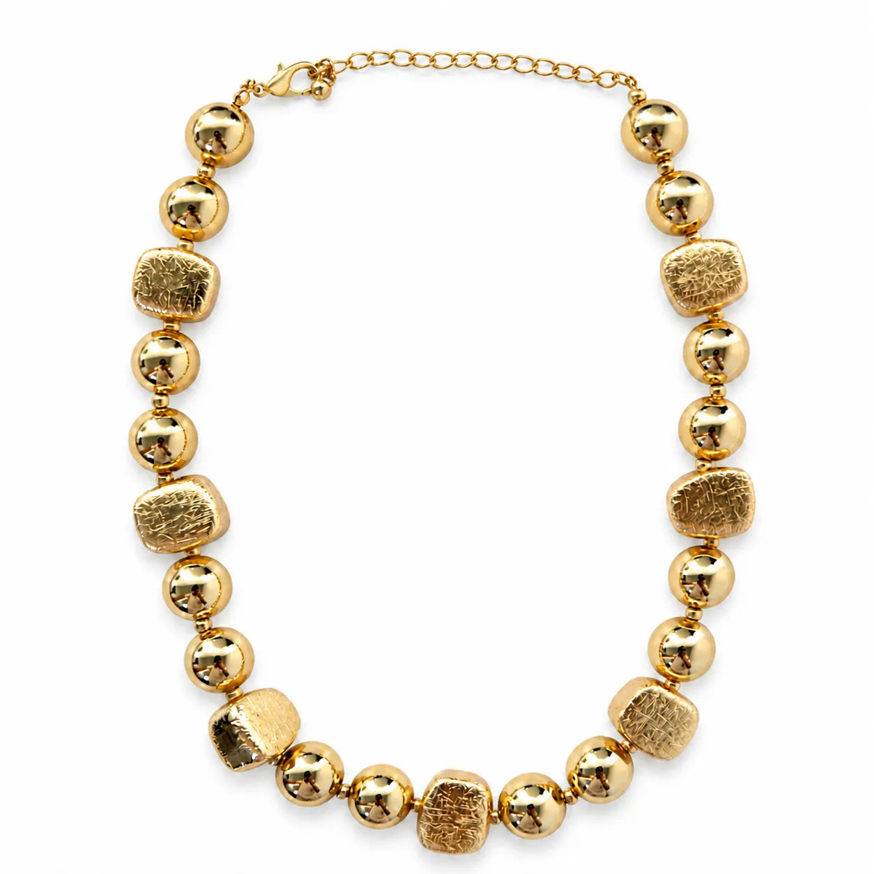 Gold necklace with large beads on a white background