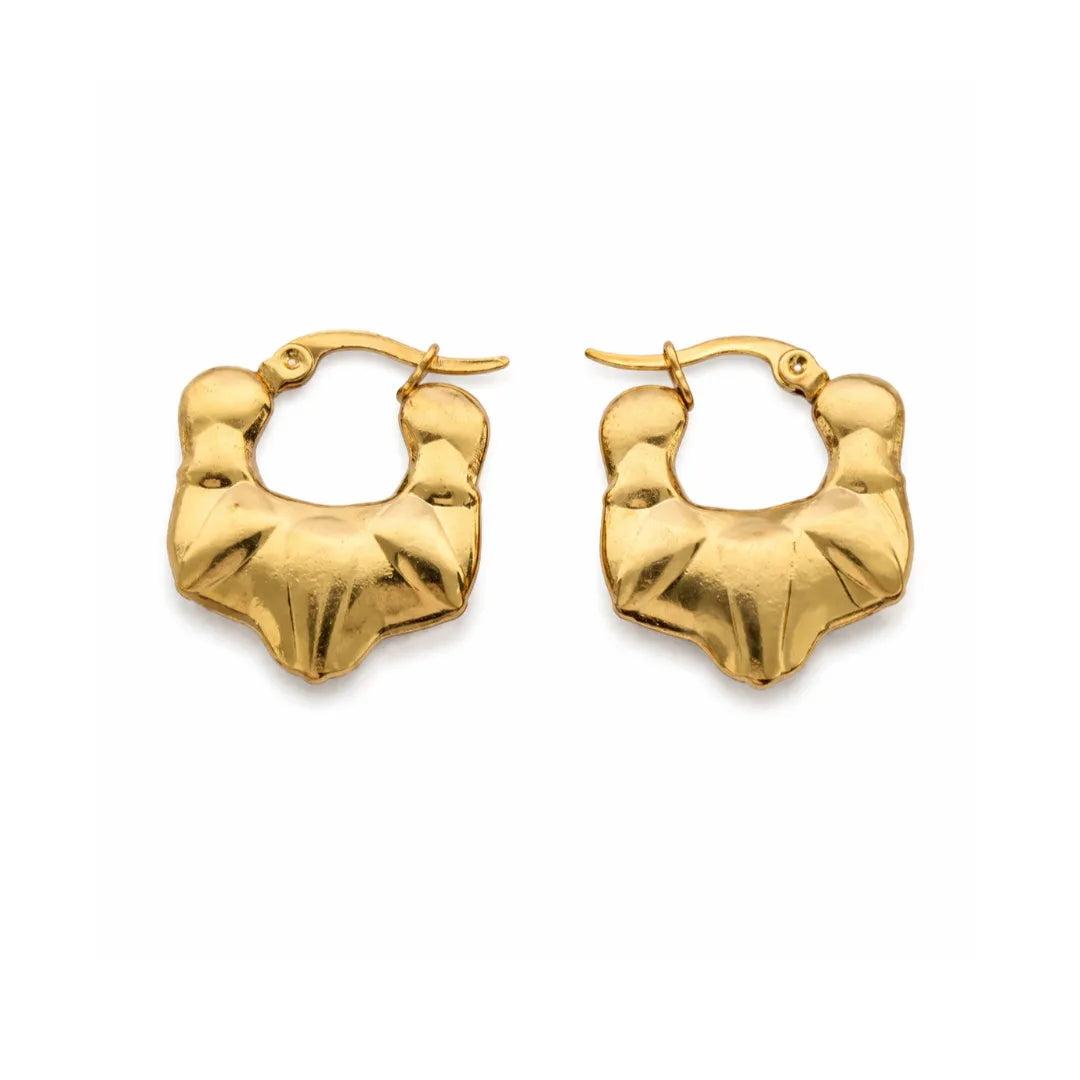 Gold hoop earrings on a white background