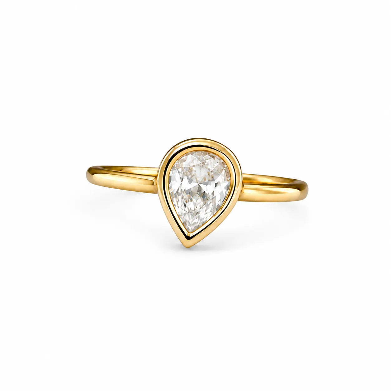 Gold ring with a heart-shaped diamond on a white background