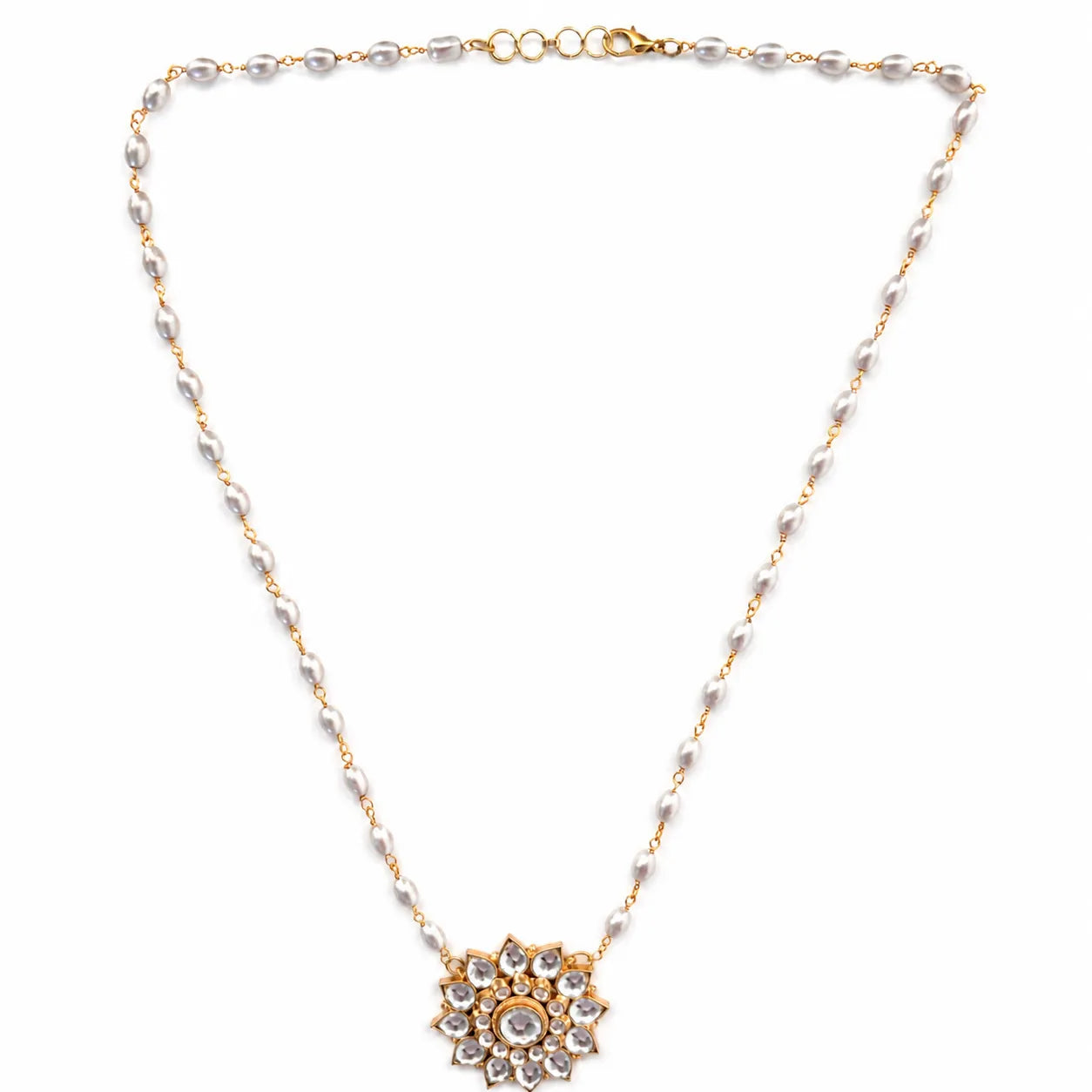 Necklace with a floral pendant and pearl chain on a white background