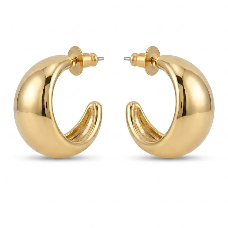 Gold hoop earrings on a white background