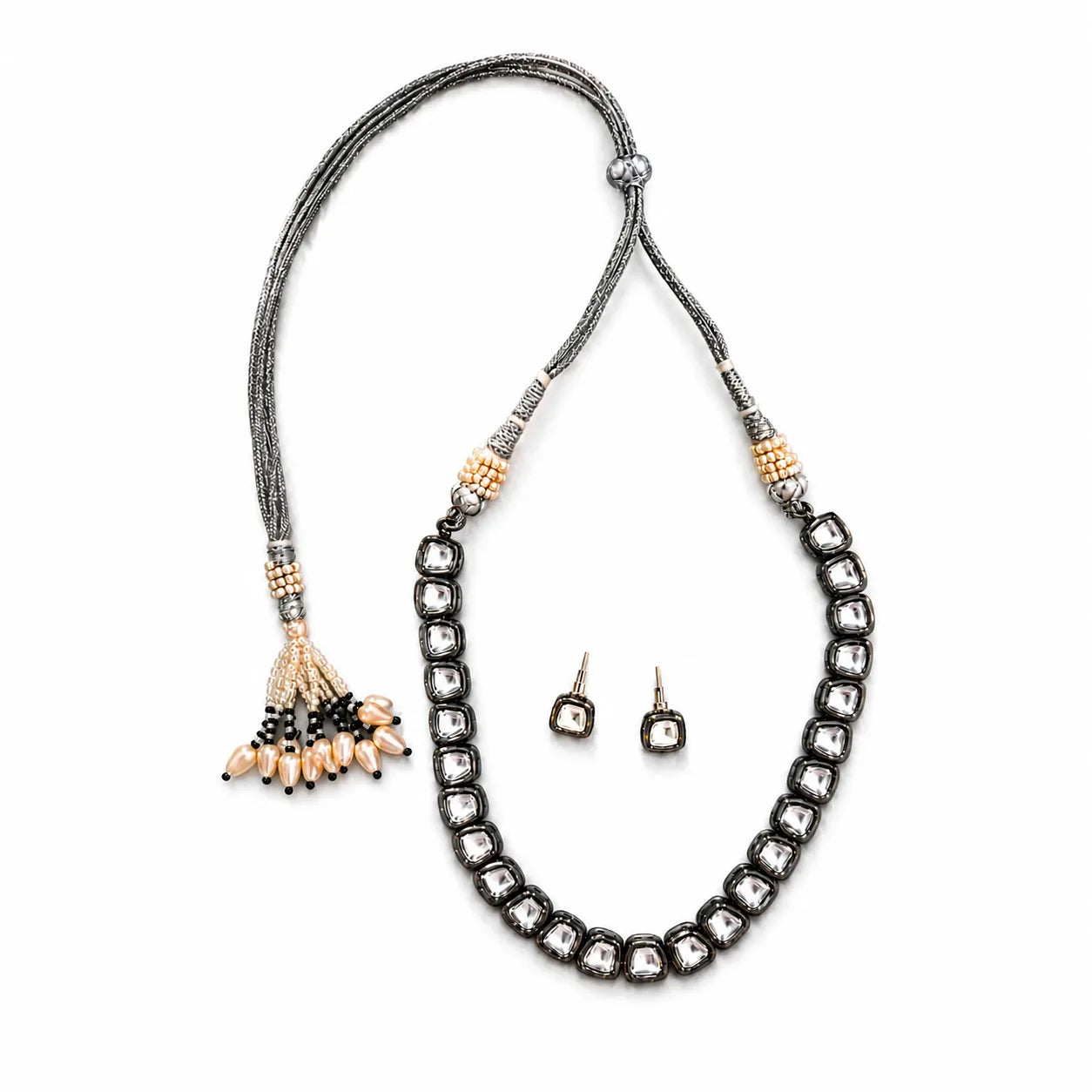 Necklace with tassels and matching earrings on a white background