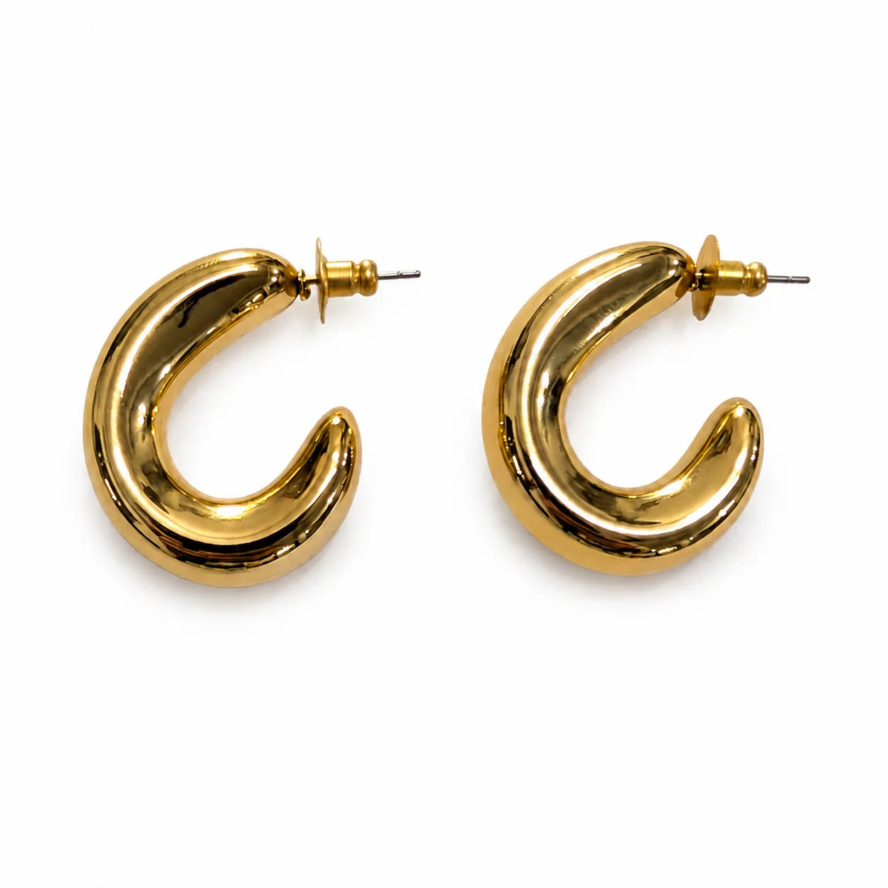 Gold hoop earrings on a white background