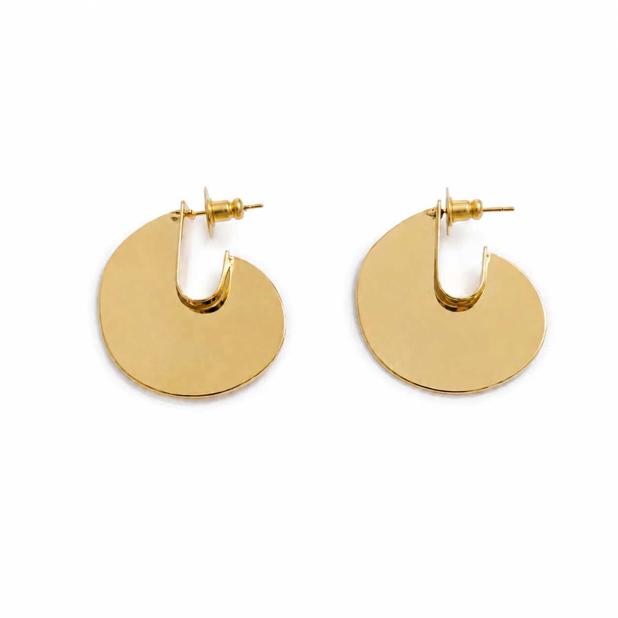 Gold hoop earrings on a white background