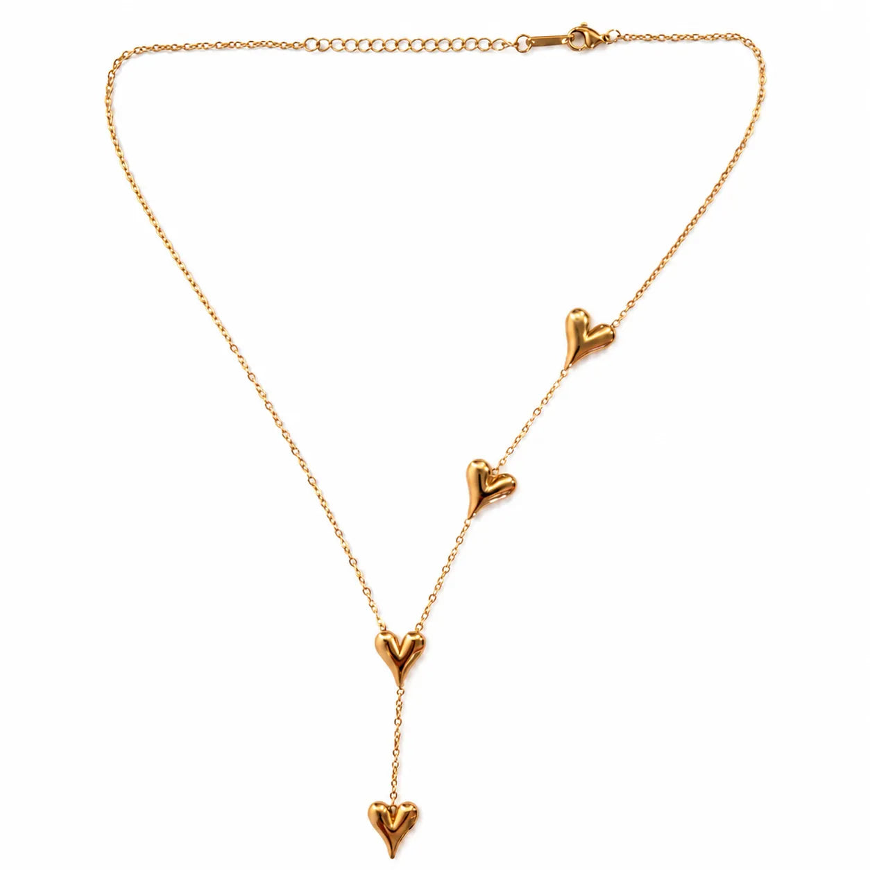 Gold necklace with heart-shaped pendants on a white background