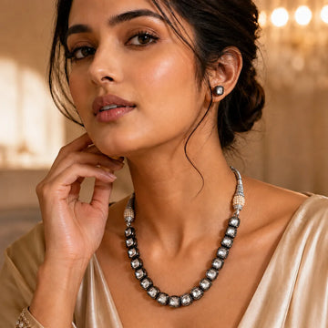Woman wearing a necklace with a blurred background