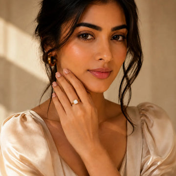 Woman wearing a ring with a beige background
