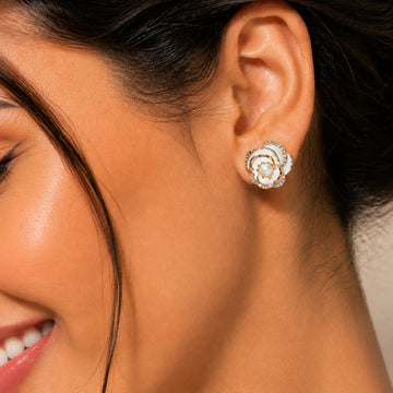 Close-up of a woman wearing a decorative earring with a blurred background
