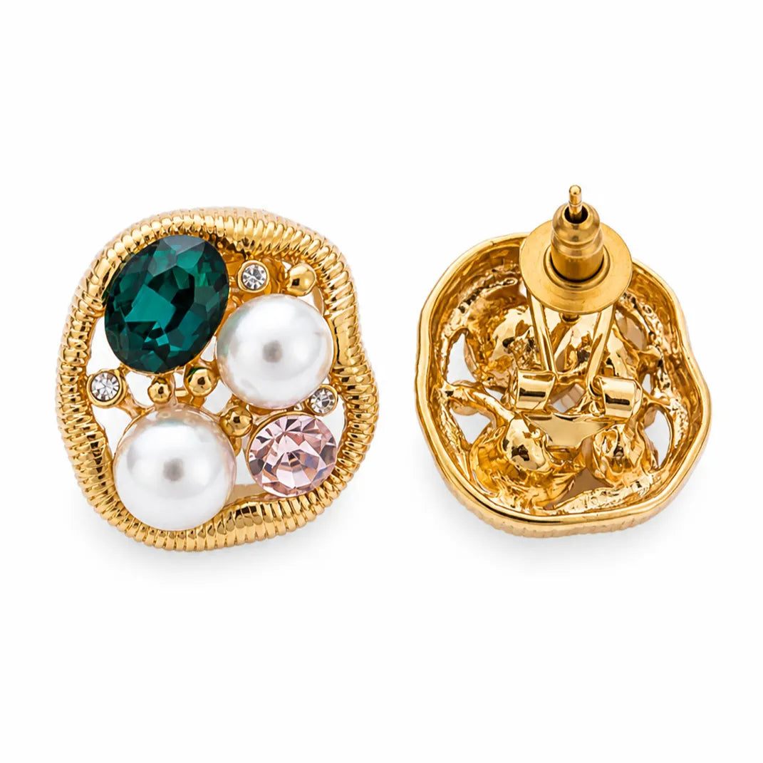 Gold earrings with gemstones on a white background