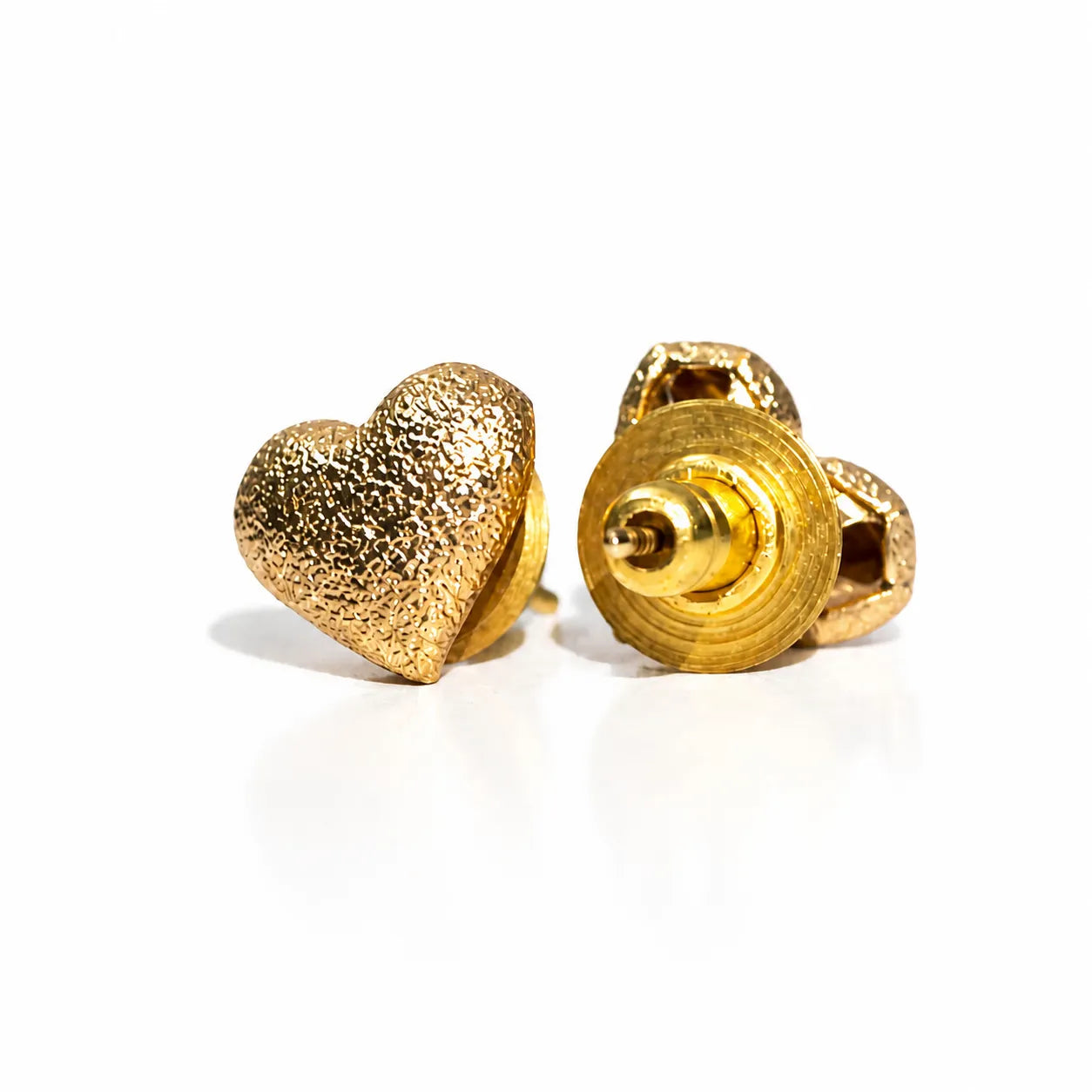 Gold heart-shaped earrings on a white background
