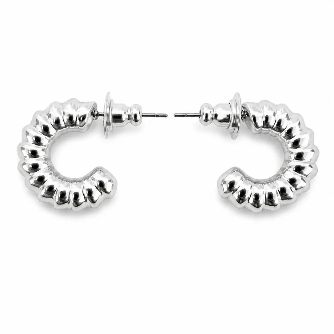 Silver hoop earrings on a white background