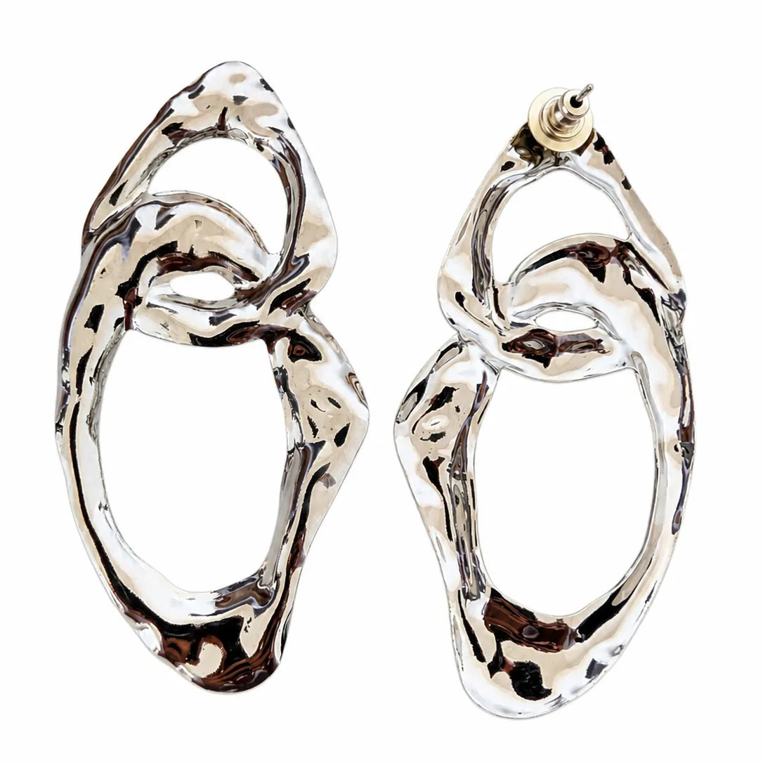 Pair of silver hoop earrings on a white background