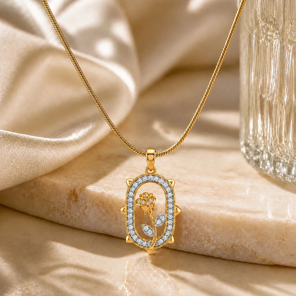 Gold necklace with a decorative pendant on a beige fabric background