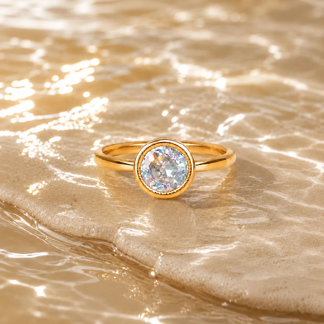 Gold ring with a diamond on a sandy surface