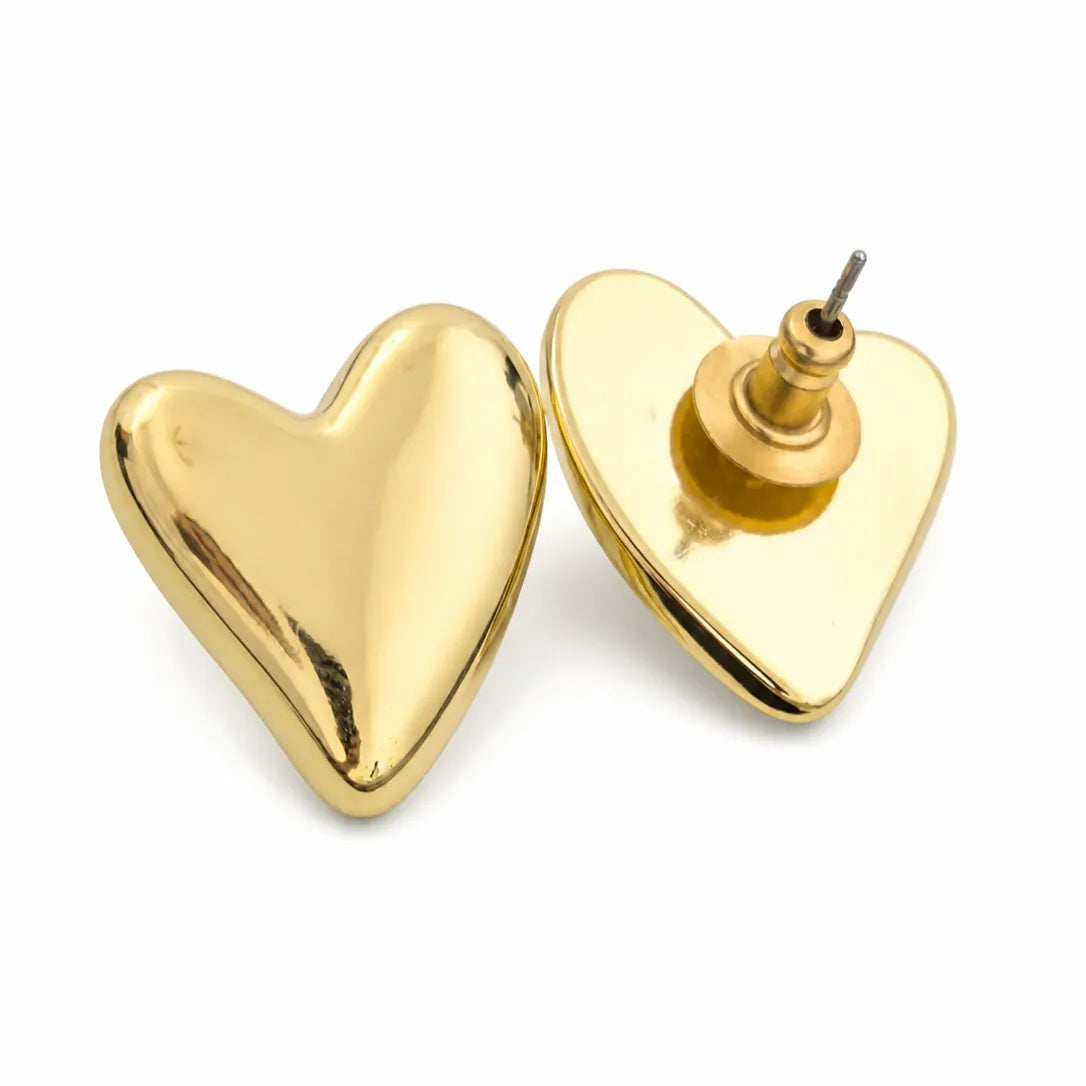 Gold heart-shaped earrings on a white background