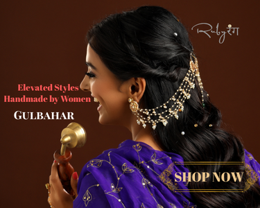 Woman wearing traditional jewelry with promotional text on a brown background Woman wearing gold best seller earrings with an ear chain in a dark brown background and text about Gulbahar New Collection from Ruby Raang