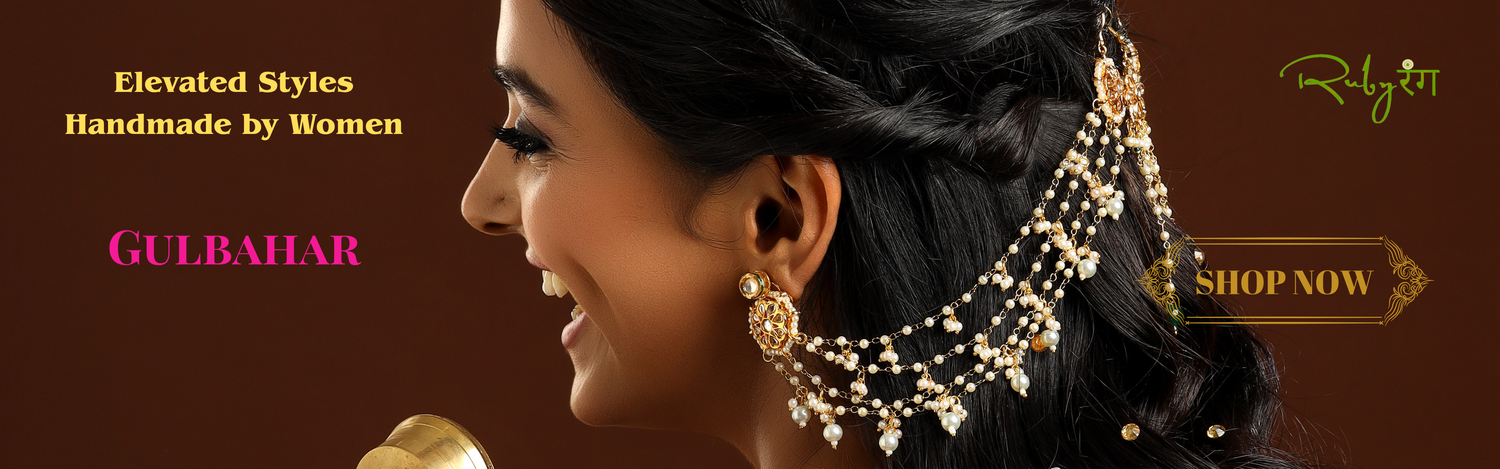 Woman wearing gold best seller earrings with an ear chain in a dark brown background and text about Gulbahar New Collection from Ruby Raang