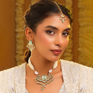 Ruby Raang Pearl glow necklace with matching Earrings and Maang Tikka