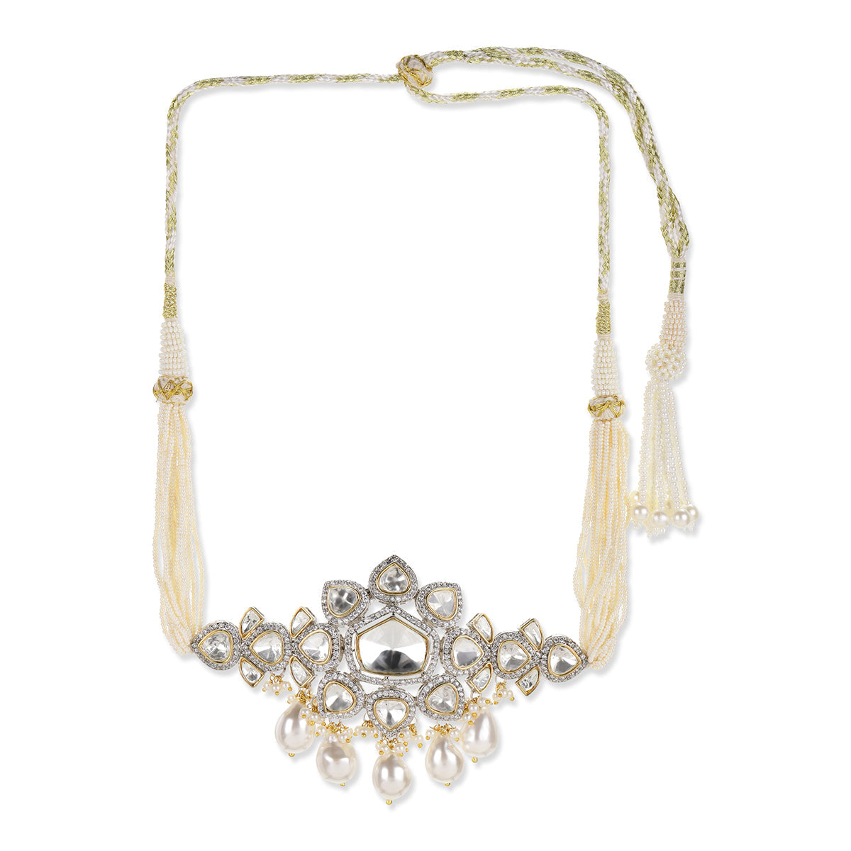 A traditional Indian choker necklace featuring a central floral motif with a silver-toned mirror, clear stones, and hanging white pearls, accented by gold-toned details and cream-colored beaded tassels on a white background.